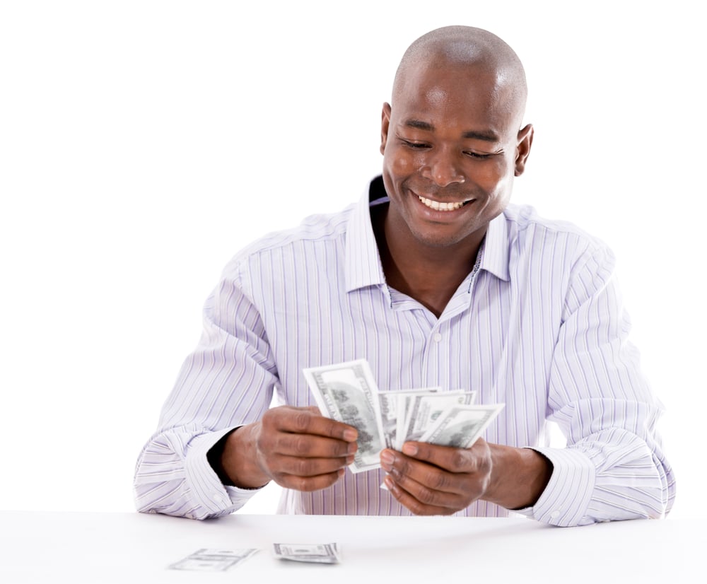 Successful business man counting money - isolated over white